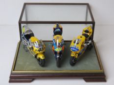 A set of three scale model Honda racing bikes presented in fine presentation case.
