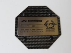 An F1 McLaren Cars Limited fibreglass chassis piece No. 969 measuring approx 8.8cm wide.