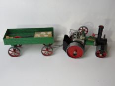 A Mamod steamroller with trailer together with Mamod solid fuel tablets in original box.