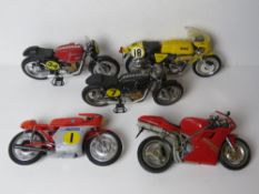 A quantity of larger scale model vintage motorbikes including Norton, AJS, MV Augusta and Ducatti.