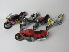 A set of five scale model racing motorbikes including Honda, Suzuki, Yamaha and Ducatti.