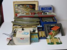 A quantity of Hornby, Meccano etc model railway etc including track, buildings and power unit etc.