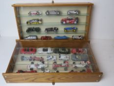 Two display cases containing a quantity of model vehicles inc rally cars,