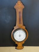 An Edwardian style inlaid wooden Aneroid barometer, thermometer missing.