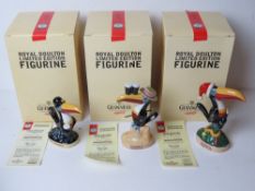 Guinness; a set of three Royal Doulton limited edition figurines being Christmas Toucan,