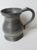 A pewter tankard marked for Yates & Birch standing approx 12cm high.