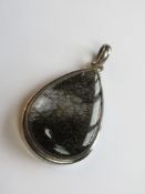 A large hardstone pendant of teardrop form set in white metal stamped 925, approx 5.6cm in length.
