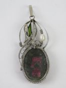 A handmade filigree floral pendant having large purple stone, 5.5cm inc bale.