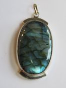 A large labradorite pendant in white metal approx 6.3cm in length.