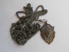 A guard chain stamped 800 to the clasp, 73cm in length including clasp (total chain length 142cm).