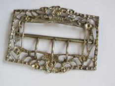 A HM silver belt buckle of floral design, partial London hallmark with maker's mark, 7.