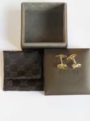 A pair of gold plated cufflinks marked for Gucci Italy in presentation pouch and box.