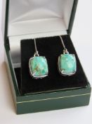 A pair of silver and turquoise earrings stamped 925 in presentation box.