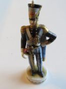 A hand painted German porcelain figurine