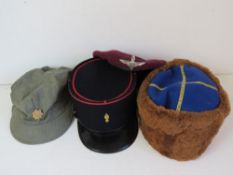 A Soviet Army brown/blue kubanka hat, a