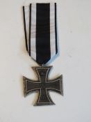 A reproduction WWI German Iron Cross wit