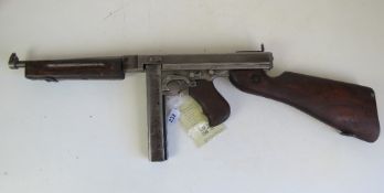 A deactivated Thompson M1A1 SMG, with late war battle sight.