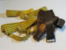 Two Soviet belts with brass buckles, a Mosin Nagant revolver holster and leather belt,