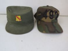 A US 32nd armoured cavalry regiment cap with badge size 7 1/8 and a 492 Otto camo cap.