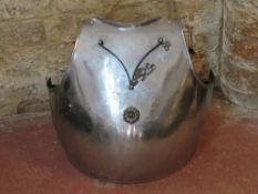 Decorative armour plate with straps.