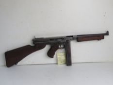 A deactivated Thompson M1A1 SMG, with late war battle sight.