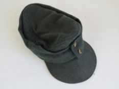 A Luftwaffe M43 cap, insignia removed.