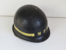 A US Vietnam MP helmet and liner.