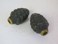 Two inert US Pineapple grenades with the RFX stamping on the side.