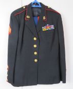 A US Marine Corp tunic and blue trousers,