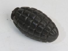 An inert WWI Austro-Hungarian Schwere hand grenade with fuse.