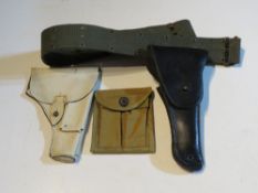An M1 carbine magazine pouch, US Colt 1911 holster and belt and a P38 Holster.