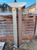 A large contemporary floorstanding decorative sculpture having metal sides with glass bowl over.