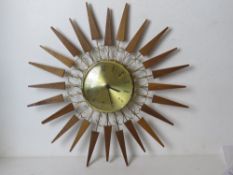 A retro mid century sunburst wall clock by Paico.