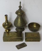 A quantity of Persian influence items including a brass and white metal needle case,