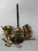 A quantity of brass and copperwares including graduated pan set, graduated grain cups,