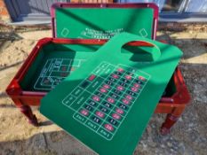 A late 20th century gaming coffee table having three baises including roulette wheel,