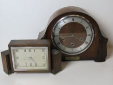 A Smiths mantle clock with key, together with an Art Deco mantle clock having chrome fittings.