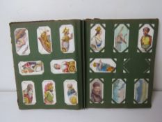 A Cigarette card album having assorted sets and part sets within.