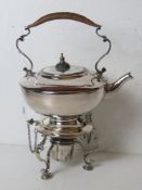 A delightful silver plated picnic teapot having hinged removable stand with spirit burner under.