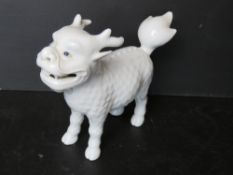 A late 19th / early 20thC Japanese Hirado porcelain figure of a Kirin - mythical creature having