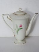 An early 20th century Royal Worcester teapot having single tulip pattern handpainted upon,
