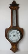 An inlaid mahogany Edwardian aneroid barometer with thermometer over.