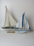 Two contemporary sailboat models.