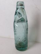 A glass Codd bottle with marble.