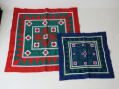 Two patchwork quilting squares.