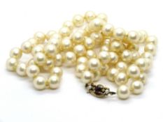 A set of faux pearls having 9ct gold clasp.