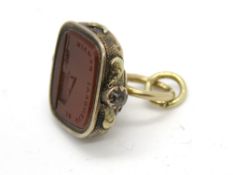 An antique carnelian seal fob having carved French motto and crest 'Je Viendrai Demain' having