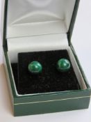 A pair of malachite stud earrings in presentation box.