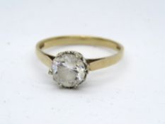 A vintage 9ct gold solitaire ring, central round cut white paste, hallmarked 375, size L-M, 2g.