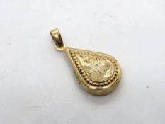 A 9ct gold teardrop shaped locket having floral engraving to front, hallmarked 375, 1.6g.
